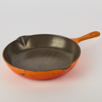 A Vintage Orange Le Creuset Skillet size 23