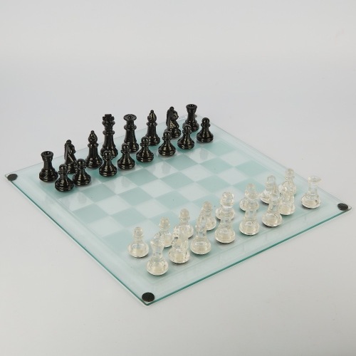 A 32-Piece Glass Chess Set on Board