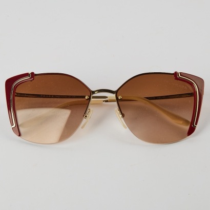 A Pair of Burgandy Prada Sunglasses