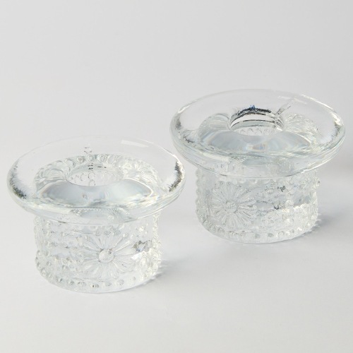 A Pair of Swedish Kosta Boda Daisy Candle Holders