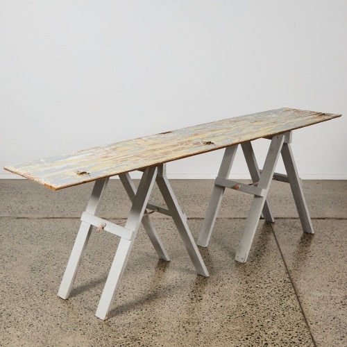 A Rustic Trestle Storage Table