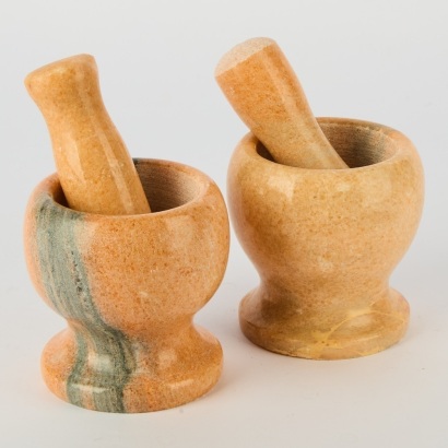 A Pair of Coral Coloured Marble Mortar and Pestle