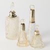 A Set of Four Antique Sterling Silver Perfume Bottles with British Hallmarks