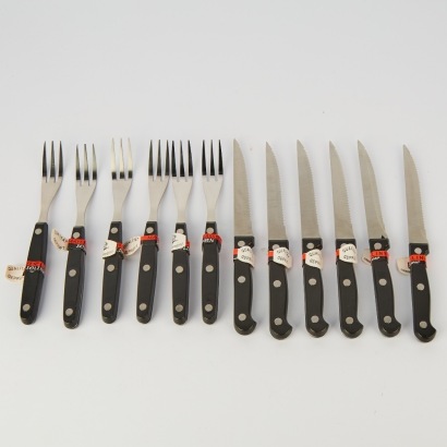 A set of twelve Bergmann Solingen Steak Knives and Forks unused