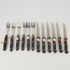 A set of twelve Bergmann Solingen Steak Knives and Forks unused