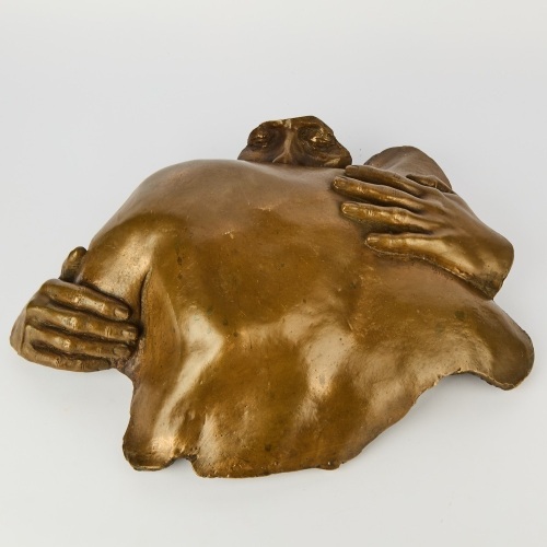 A Wall-Hung Bronzed Sculpture
