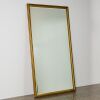 A Large Bevelled Rectangular Glass Mirror in a Gold Frame