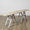 A Rustic Trestle Storage Table