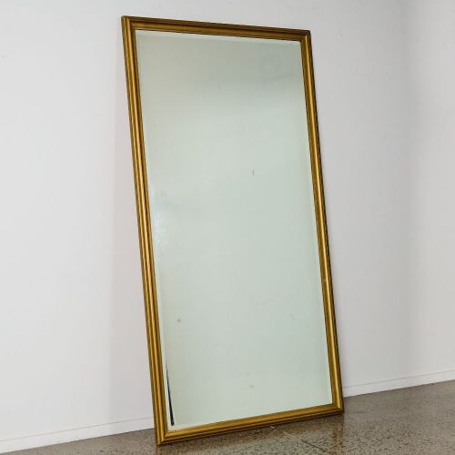 A Large Bevelled Rectangular Glass Mirror in a Gold Frame