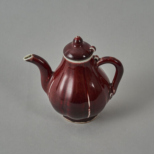 A Chinese Red-glazed Teapot (Da Ming Xuande Nian Zhi Mark)