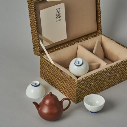 A Chinese Red Clay Teapot (Meng Chen Mark) and Three White Glazed Tea Cups (He Qi Mark)