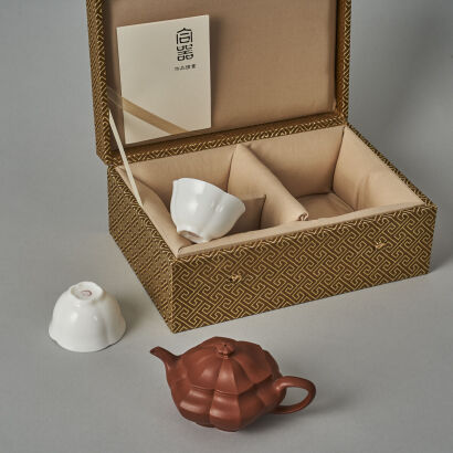 A Chinese Red Clay Teapot (Marks on the lid and base) and Two White Glazed Tea Cups