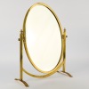 A Hollywood Regency Brass Cheval Table Mirror