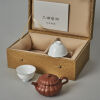 A Chinese Red Clay Teapot (Wang Shuyun Mark) and Two White Glazed Tea Cups