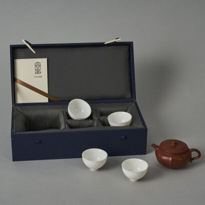 A Chinese Red Clay Teapot (Sun Yanmin Zhi Mark) and Four White Glazed Tea Cups