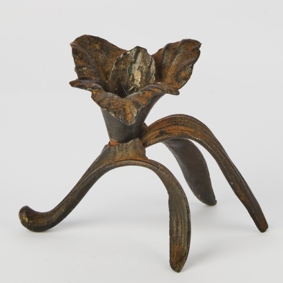 A Cast Iron Lily Candle Holder