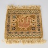A Small Rug Depicting a Bird