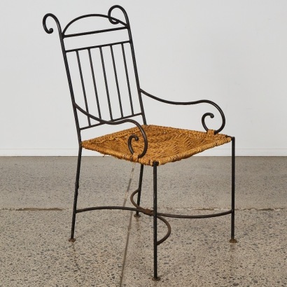 A Post Modern Wrought Iron Armchair with Woven Seat