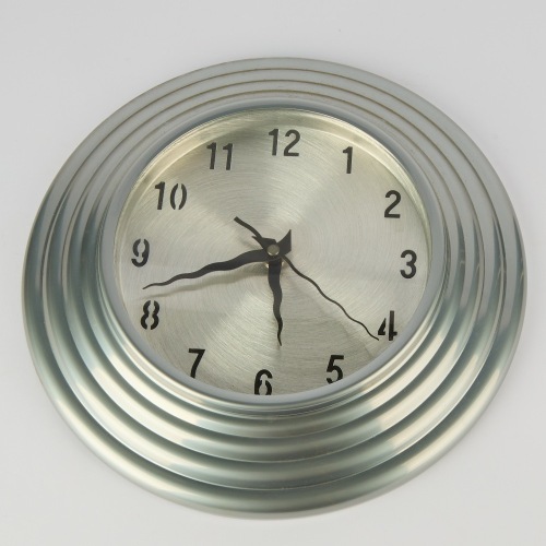 A Wiggly Handed Post Modern Style Wall Clock with Ribbed Egde