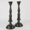 A Pair of Large Black Metal Column Candleholders