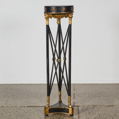 An Egyptian Revival Style Black and Gilt Pedestal