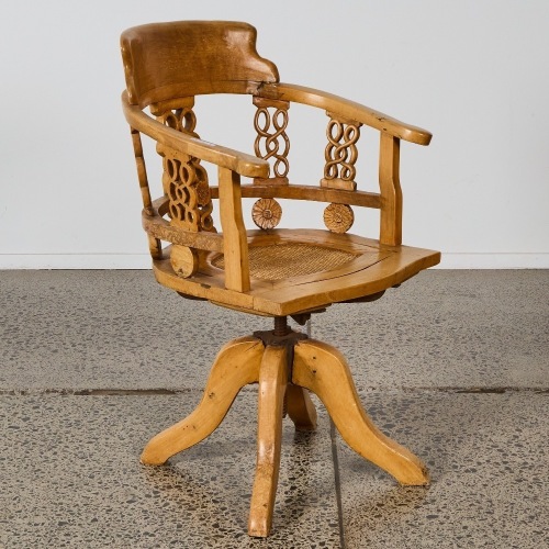 An Aged Wooden Armchair with Swivel Seat