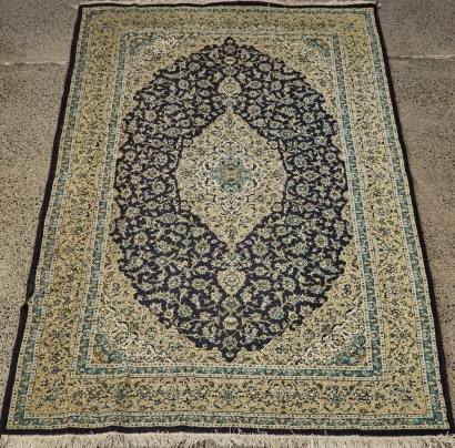 A Large Persian Floor Rug