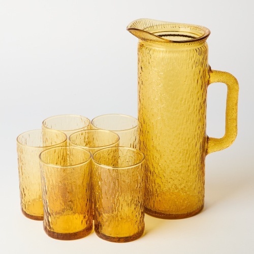 A Set of Six Kaaru Amber Sandrift Glass Tumblers and Pitcher