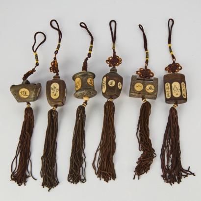 A Group of Six Chinese 20th Century Carved Wood Small Pendants