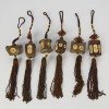 A Group of Six Chinese 20th Century Carved Wood Small Pendants