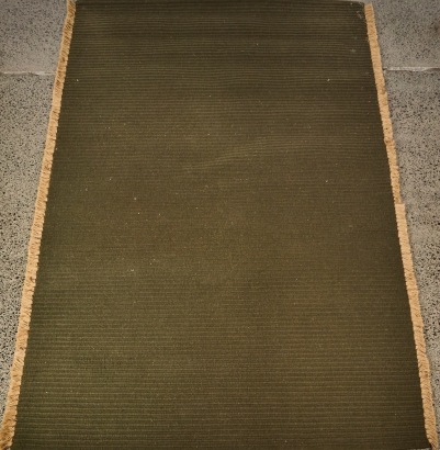 A Handwoven Nodi Tasseled Wool Rug