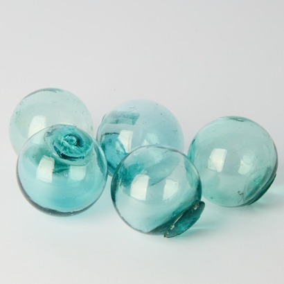 A collection of five Antique Japanese Glass Fish Floats