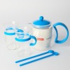 A Bodum 70 year Anniversary Boxed Tea Press, two cups and two Tall spoons Blue (never used)
