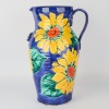 A Tall Morris and James Urn with Sunflowers