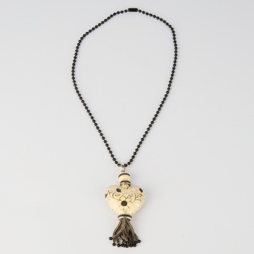 A Sterling Silver Enamel and Black Onyx Heart Tassell Pendant