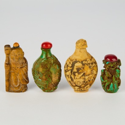 A Set of Four Chinese Jadeite Snuff Bottles of Various Colors