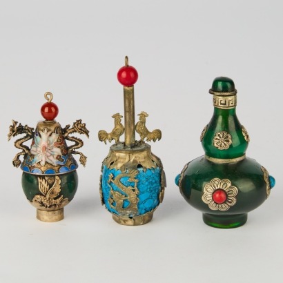 A Set of Three Chinese Metal-Mounted Glass Snuff Bottles