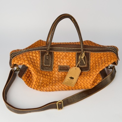 A Tan Woven Leather Carry On Bag by Teddy Sinclair