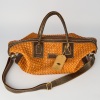 A Tan Woven Leather Carry On Bag by Teddy Sinclair