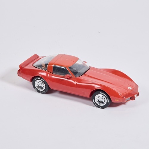A Corvette ceramic decanter, red