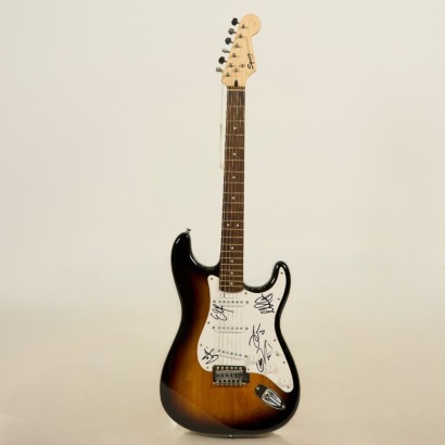 A Guitar Signed by Six-60