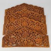 A Set of Four South Asian Carved Wood Floral Panels