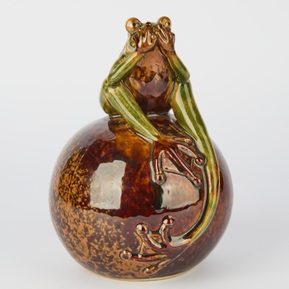 A Glazed Pottery Frog on Sphere