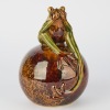 A Glazed Pottery Frog on Sphere