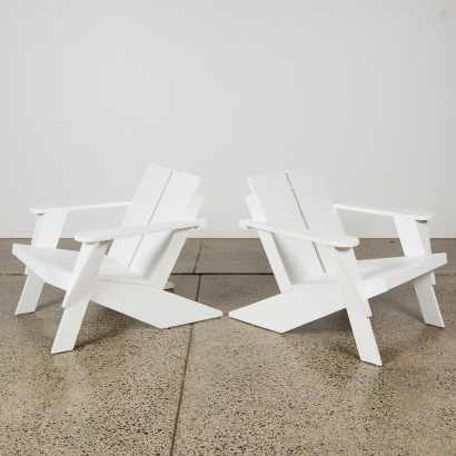 A Pair of Wooden Adirondack Outdoor Chairs