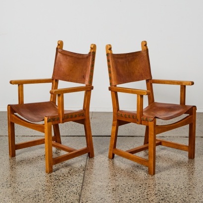 A Pair of Mid-Century Caryngo Style Saddle Leather Chairs