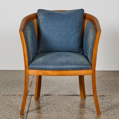 A Blue Upholstered Barrel Back Armchair