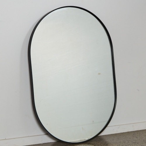 An Oval Minimal Wall Mirror