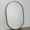 An Oval Minimal Wall Mirror