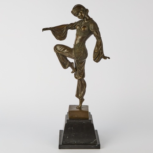 A Metal Statue in the Style of Demetre Chiparus